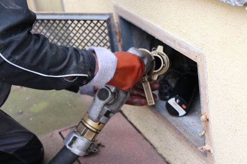 COD heating oil delivery nozzle locked into a home fill pipe in Patchogue, NY