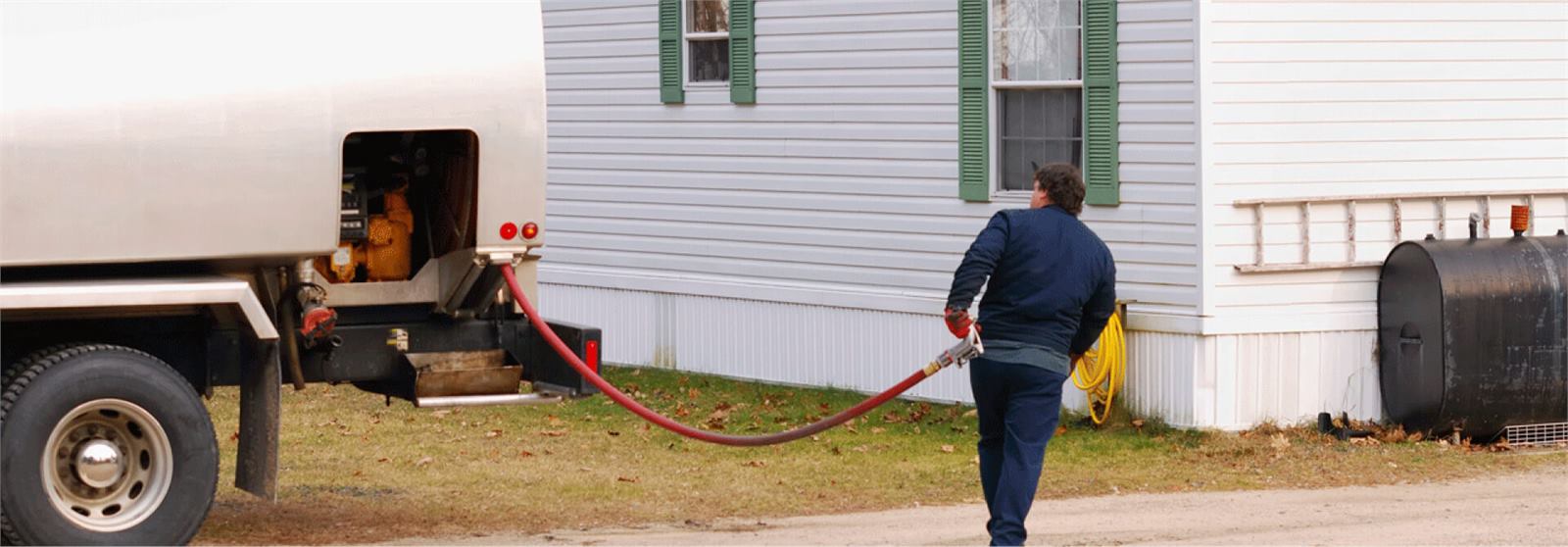 Patchogue Fuel heating oil delivery truck filling a home oil tank in Patchogue, NY
